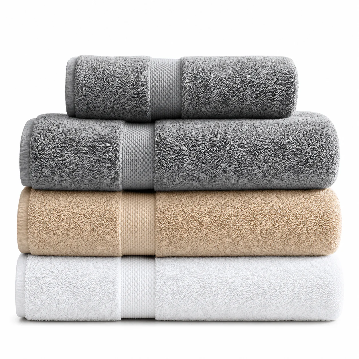 Stacked grey, beige and white terry towels